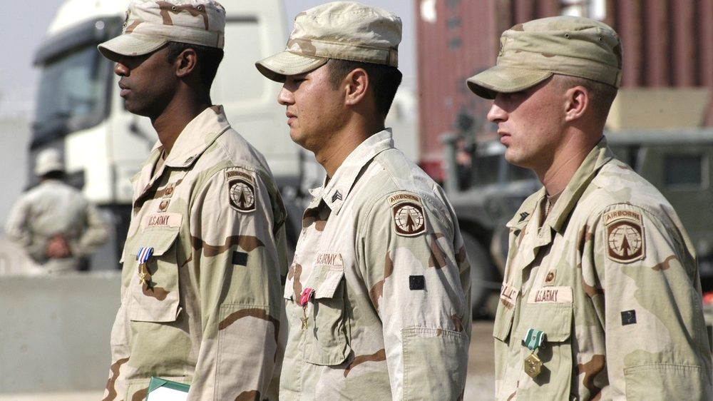 Soldiers standing in formation at an awards ceremony in theater